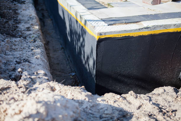 Professional Basement Waterproofing technician working in Wawaka, IN